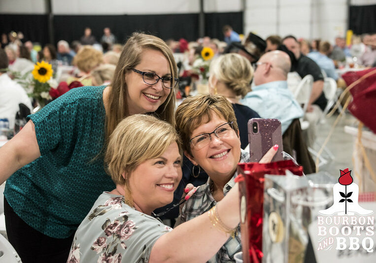 Guests at the most recent Bourbon, Boots & BBQ Derby Eve Party.